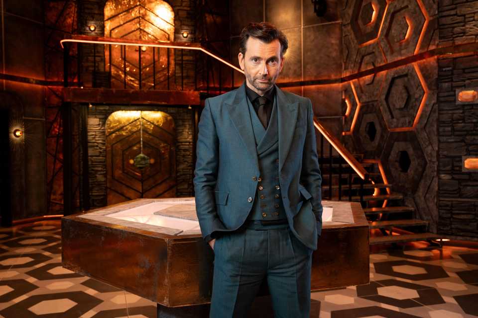 David Tennant in a teal suit on the set of Remarkable Entertainment.