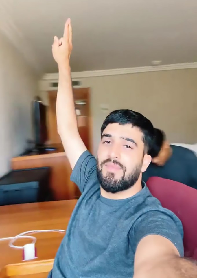 Man livestreaming on TikTok.