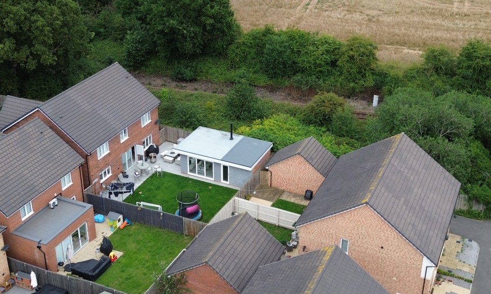 Aerial view of a house extension rejected after construction.