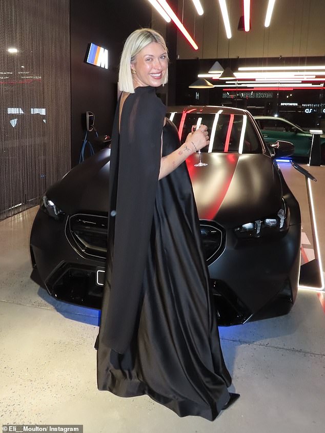 Eli Moulton pictured wearing the dress and accompanying long scarf that almost 'decapitated' her