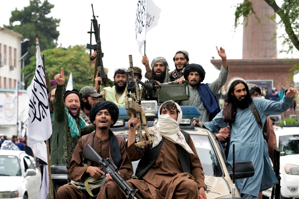 Taliban fighters celebrating their takeover of Kabul.