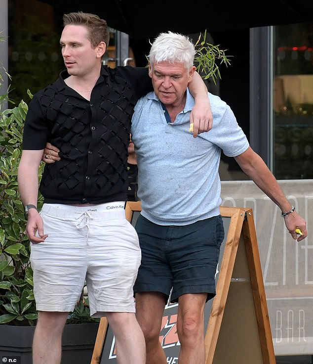 Phillip Schofield had a supportive shoulder to lean on as he rounded off a boozy visit to the pub on Tuesday afternoon - and as he knows all too well, it wouldn't be the first