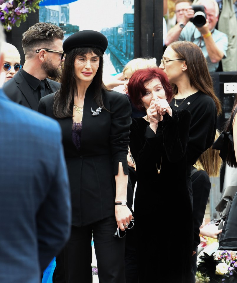Sharon and Aimee Osbourne at a funeral.