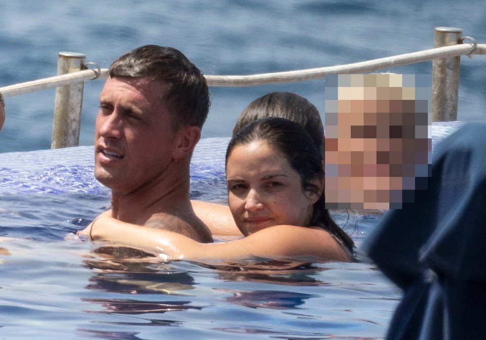 Jacqueline Jossa and Dan Osborne on a family holiday in a pool.