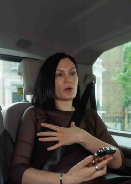 Jessie J in a car, talking.