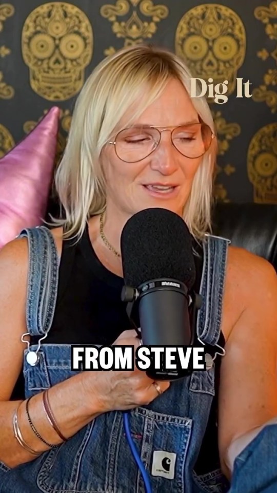 Woman speaking into microphone during podcast recording.