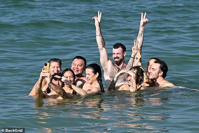 Nevertheless the Roar singer was not alone during her latest outing, accompanied by a cheerful group of friends who traipsed into the water with her