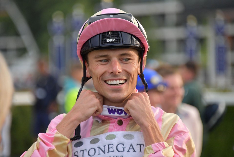 Kieran Shoemark adjusting his jockey silks.