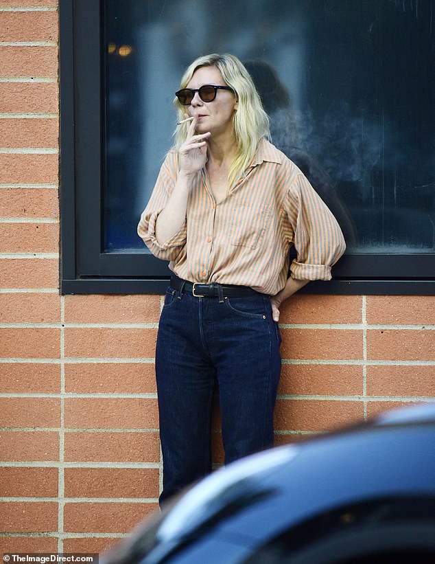 Kirsten Dunst, 43, was spotted enjoying a smoke break outside a cafe in Los Angeles on Monday