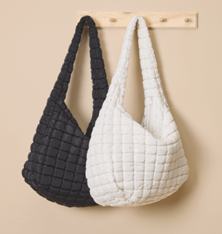 Black and cream quilted shoulder bags.