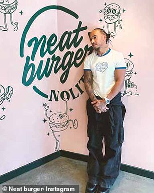 Sir Lewis Hamilton in a Neat Burger restaurant