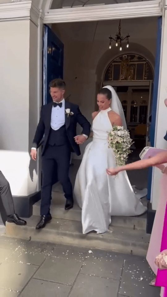 Newlyweds leaving a wedding ceremony.