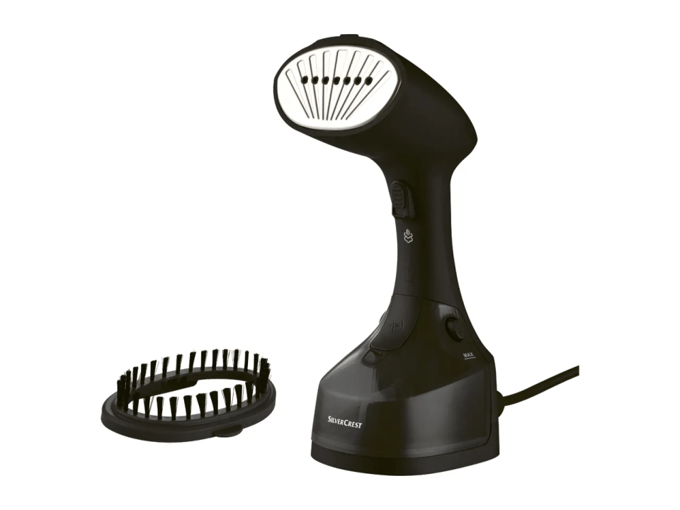Black garment steamer with brush attachment.