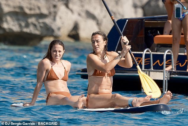 Two weeks ago Lucy Bronze (right) and Ona Batlle (left) were flying into each other with tackles as the Lionesses beat Spain in the Euros