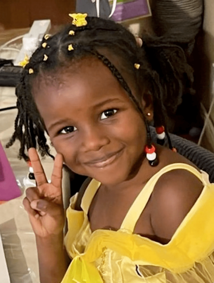 Girl giving peace sign.