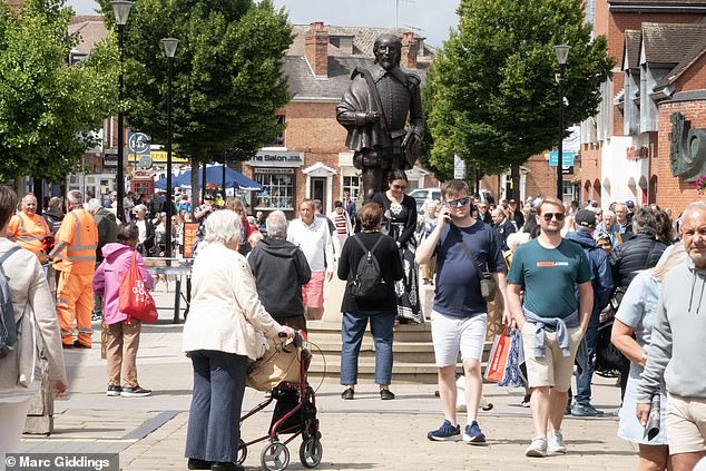 The medieval town of Stratford-upon-Avon is always bustling with visitors paying homage to the birthplace of William Shakespeare. Pictured: The busy town centre this week where a statue of Shakespeare stands towers over tourists