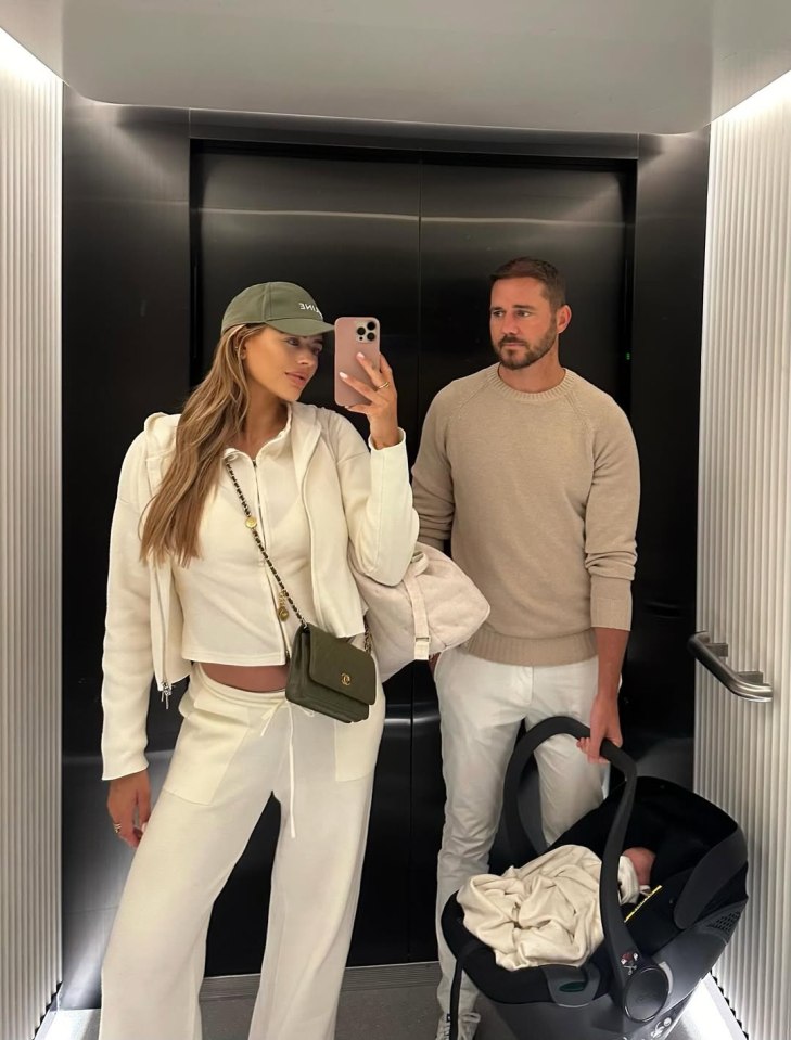 Arabella Chi and her partner in an elevator with their newborn baby.