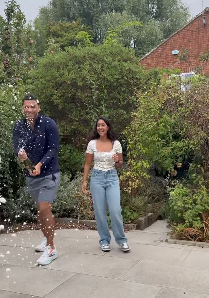 Love Island winners Kai and Sanam celebrating at their new home.