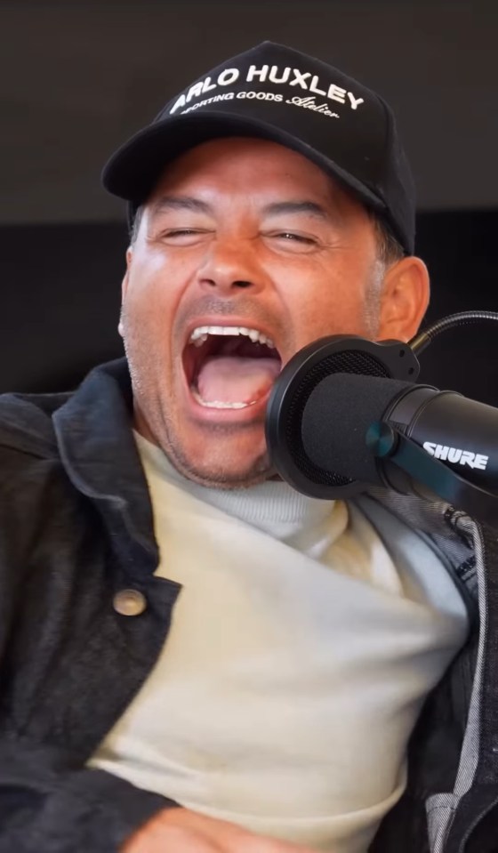 Ryan Thomas speaking into a microphone.