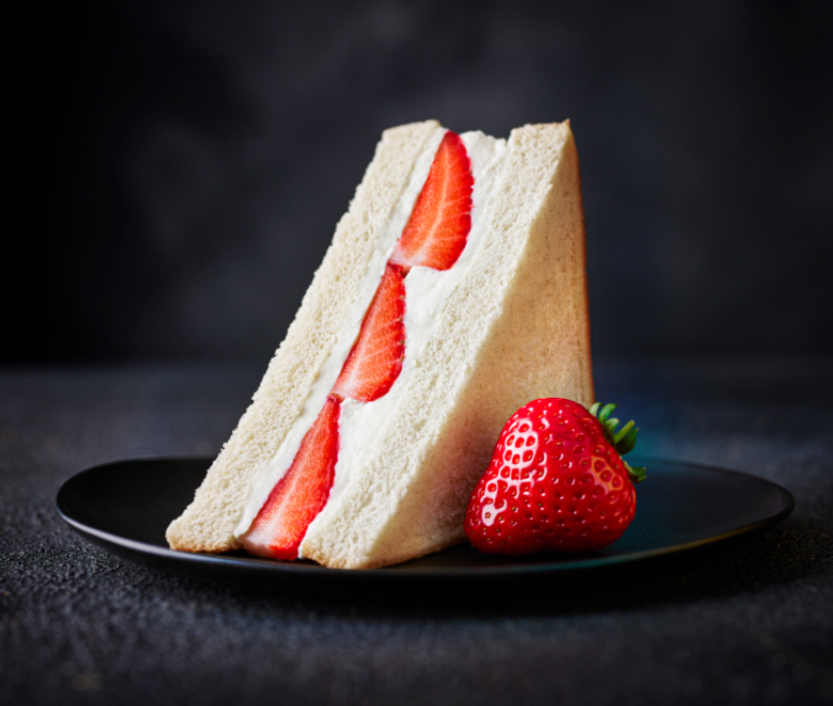 Strawberry and cream sandwich on a plate.