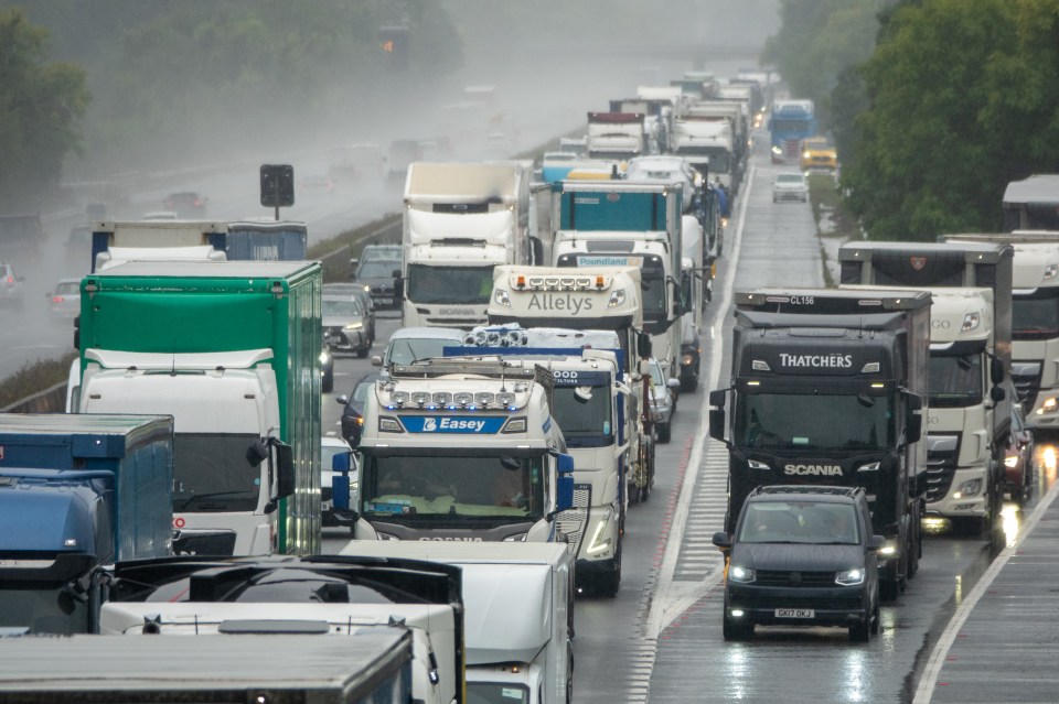 Traffic jam on a rain-slicked motorway.