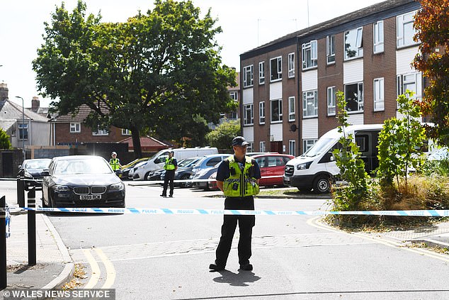 Police at the scene on South Morgan Place in Riverside, Cardiff, where a woman found was found dead in the street