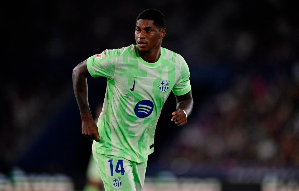 Marcus Rashford of FC Barcelona in a lime green jersey.