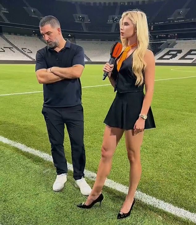 Shakhtar Donetsk head coach Arda Turan appeared to be straining every bone in his body to avoid eye contact with the club's glamorous reporter