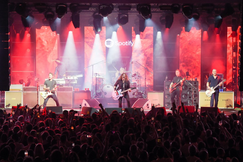 Foo Fighters performing live on a Spotify-sponsored stage.