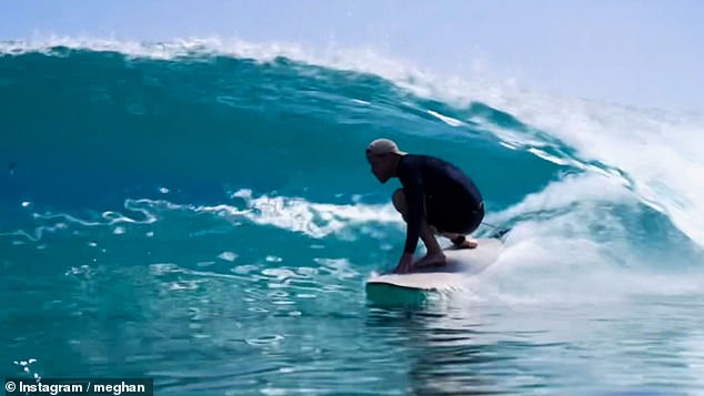 Meghan Markle has shared a new video of Prince Harry surfing on Instagram - alongside a soundtrack celebrating him as 'what a mighty mighty good man'