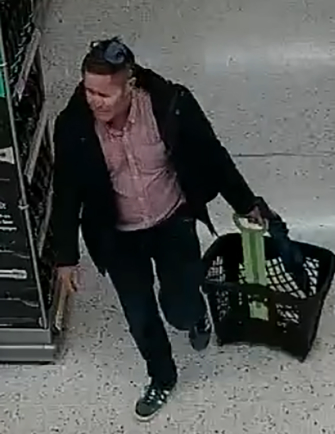 Surveillance image of Robert Brown carrying a shopping basket.