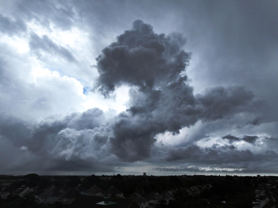 Storm clouds over houses.