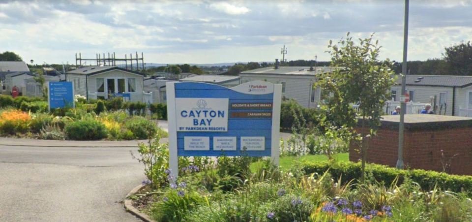 Cayton Bay Holiday Park sign and park entrance.