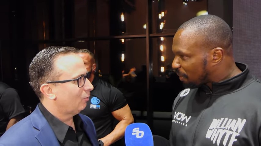 Dillian Whyte confronting an announcer.