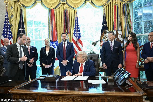 Will Scharf explains to the president the importance of his executive orders in the Oval Office on Monday