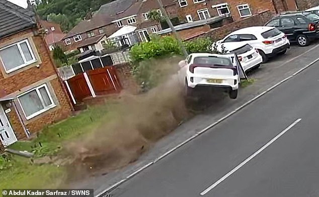 This is the terrifying moment a driver flips their car before destroying a lamppost nearly two houses away in a dramatic crash