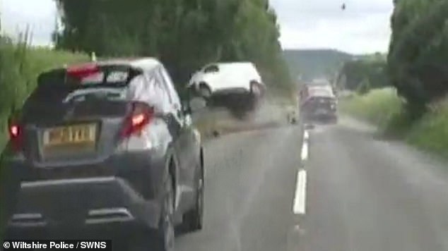 After several near-misses, Henriques finally crashed into a white Citroen van - sending it flying into a hedge