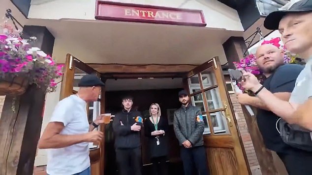 A crowd of pub-goers wearing England flags have been turned away from a boozer in Birmingham for refusing to remove the symbol