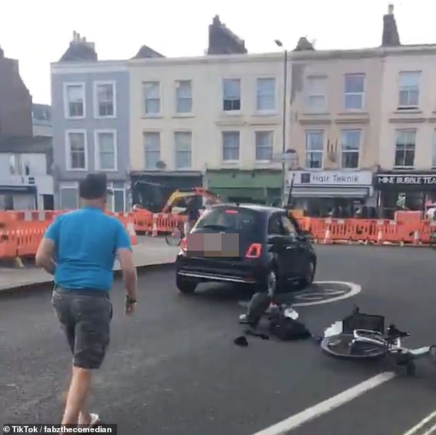 In a bid to deter the driver, Mr Van Erp pushed his bike into the road and the car, smashing the bike into pieces