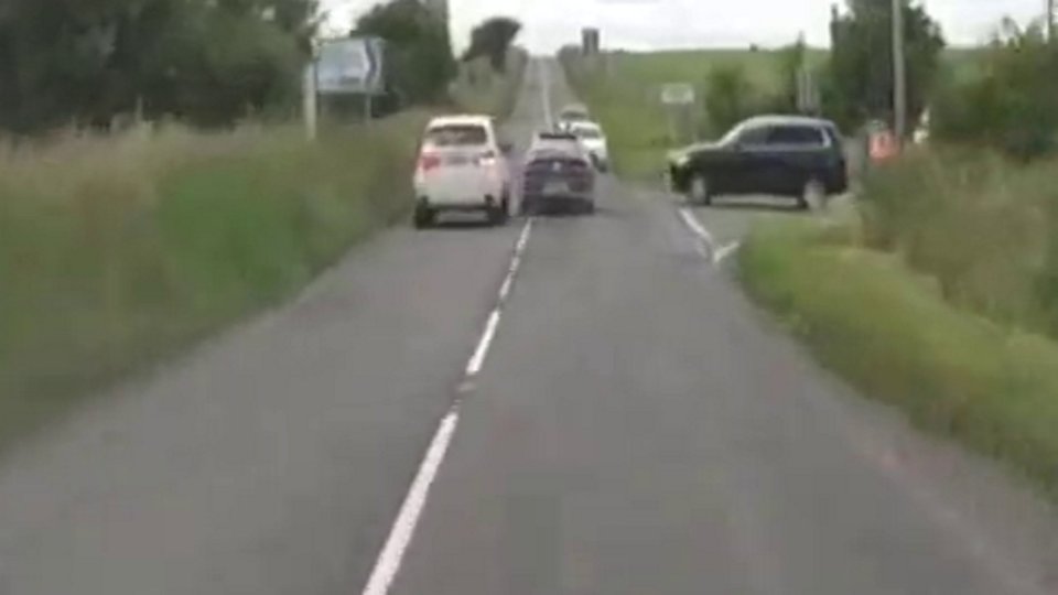Police pursuit on a country road.