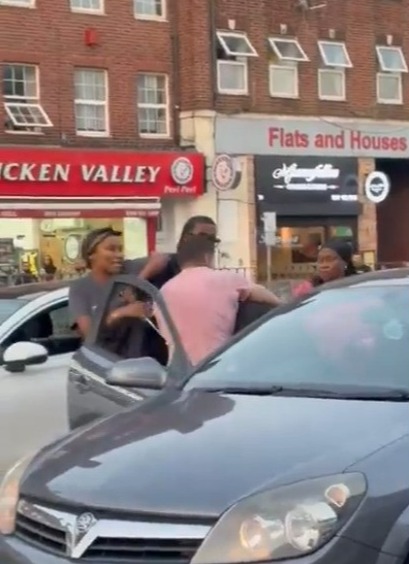 Moment road rage erupts into vicious brawl with driver chased down, tackled & kicked after putting woman in headlock, ,