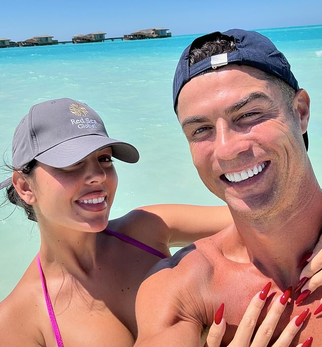 Georgina Rodríguez is about to complete one of the most extraordinary rags-to-riches stories the world has ever known when she finally becomes Mrs Ronaldo and cements her position as the grandest and wealthiest WAG of them all. Pictured: Ms Rodríguez and Cristiano Ronaldo