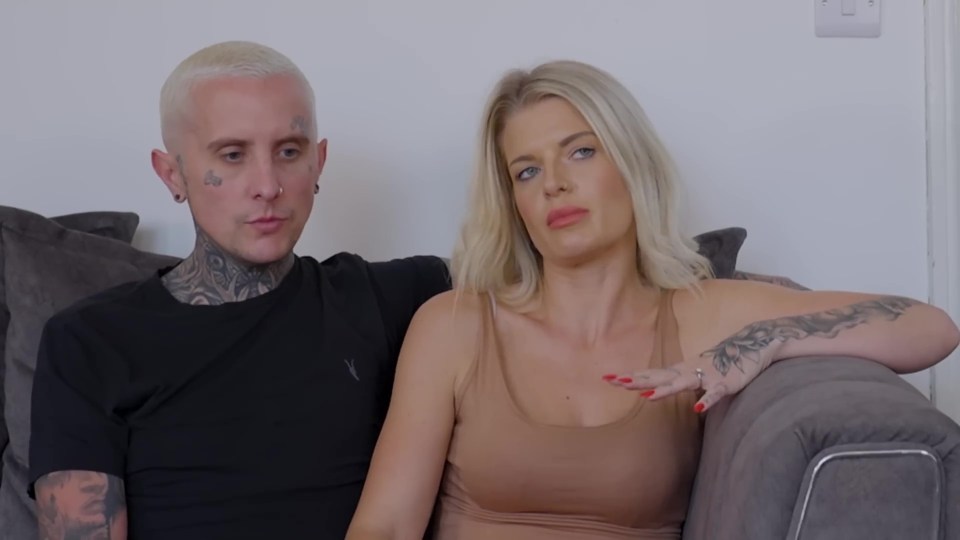 Couple sitting on a couch.