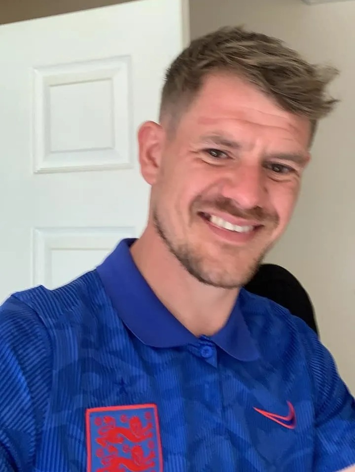 Photo of Matthew Jones wearing a blue England jersey.