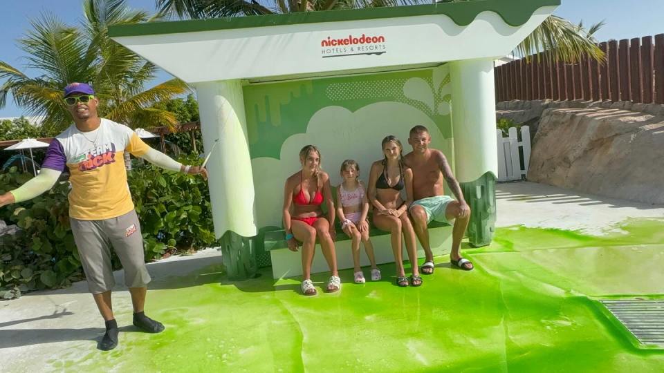 Family posing at Nickelodeon Hotels & Resorts.