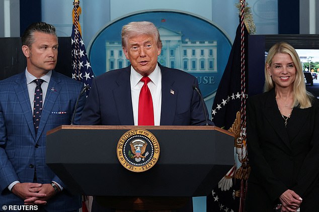 President Donald Trump speaks at a White House press briefing flanked by Attorney General Pam Bondi and Secretary of Defense Pete Hegseth
