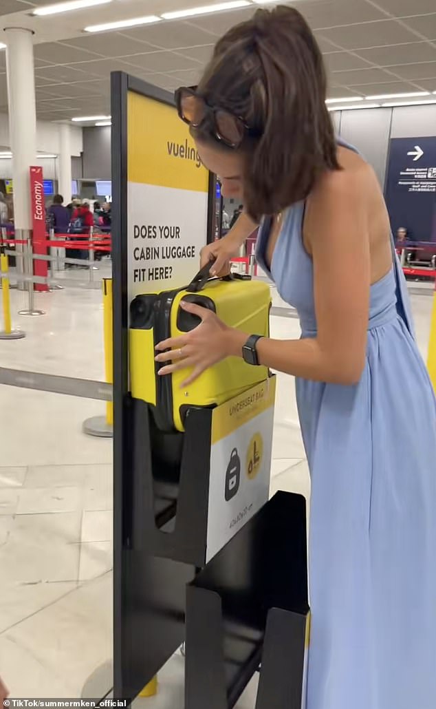 A determined passenger avoided a £180 fine for oversized baggage on her flight to London by hammering her luggage into a bag size checker