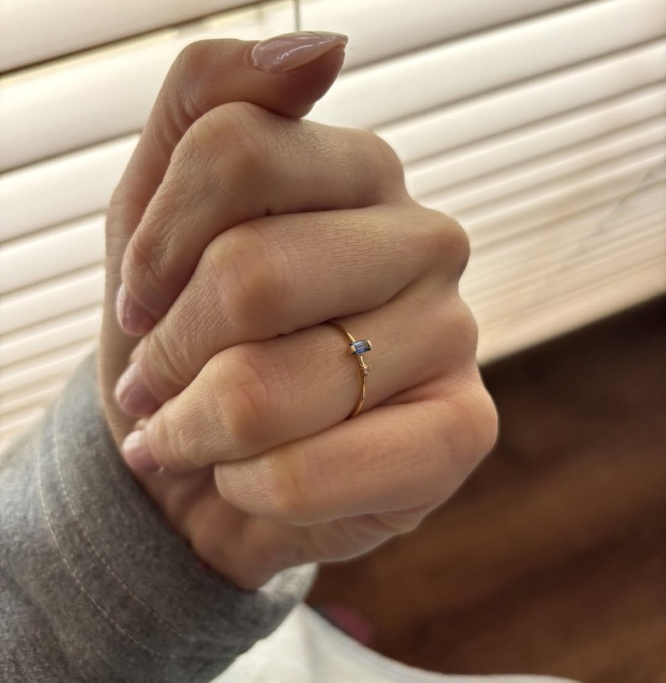 Gold ring with blue and white stones.