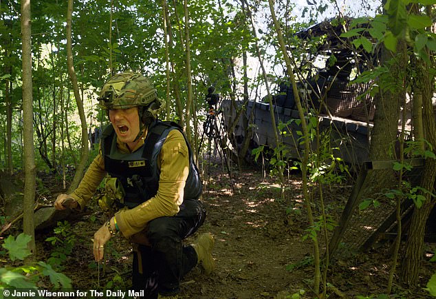 Richard Pendlebury reacts as tanks fire on the Sumy frontline in Eastern Ukraine