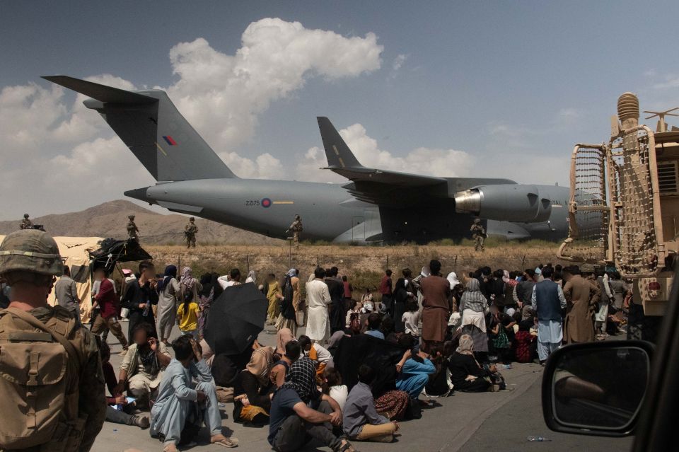 UK Armed Forces personnel evacuating people from Kabul airport.